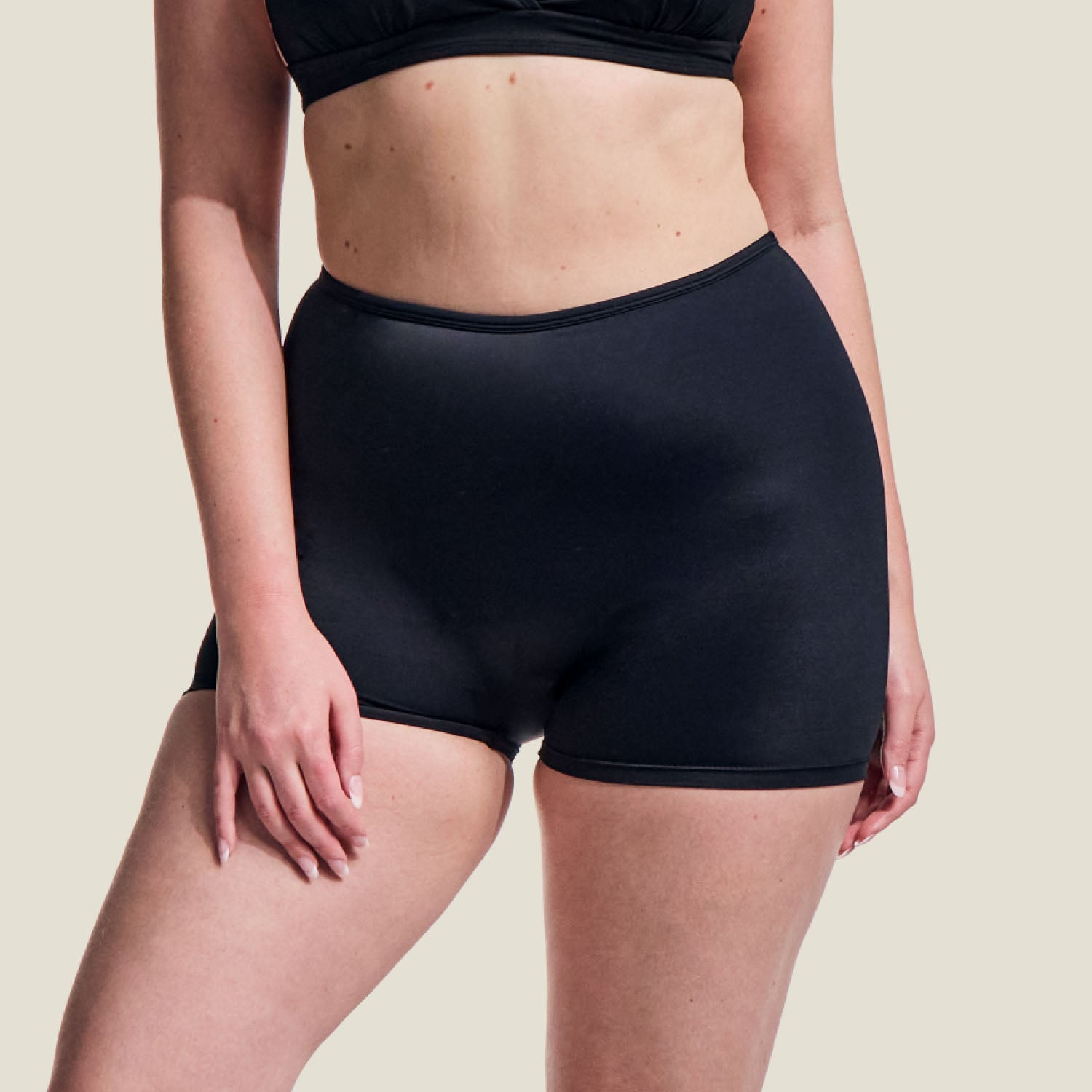 Front close-up of WUKA medium flow period swim shorts, showing seamless design and high-rise waist.