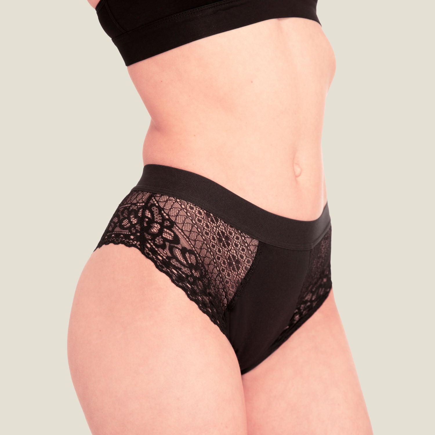 Close-up front view of WUKA Ultimate™ Lace Hipster Brief – black medium flow period pants with intricate floral lace panels and soft cotton gusset for all-day leak-proof protection.