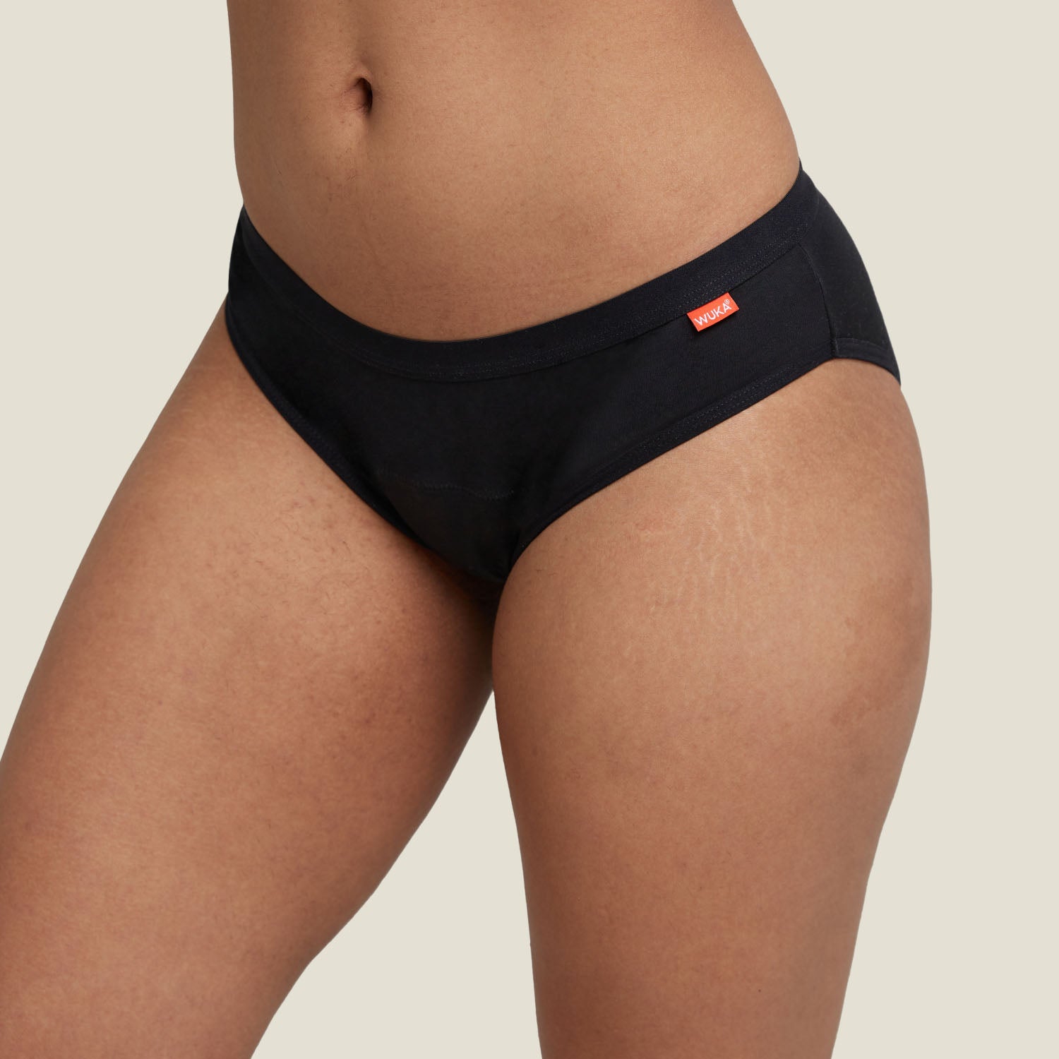 Close-up front view of the WUKA Basics™ Hipster period underwear showcasing comfortable fit and logo tag.