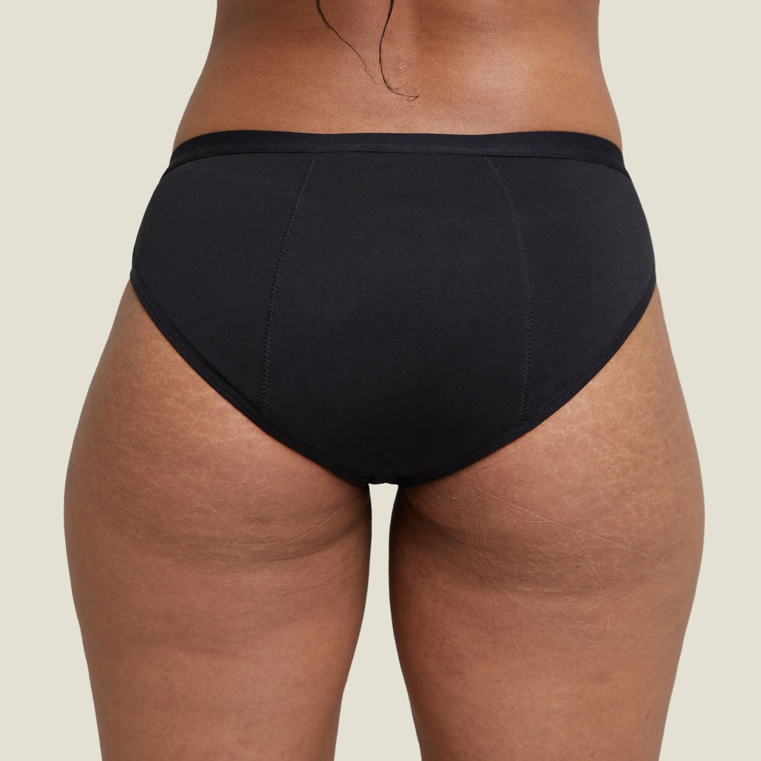 Rear view of WUKA Basics™ Hipster medium flow underwear, highlighting full coverage and seamless fit.