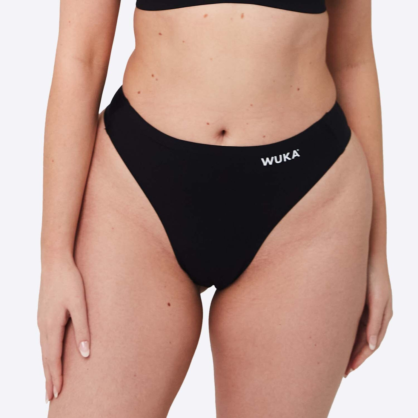 WUKA Stretch Thong Style Light to Medium Absorbency Black Colour Close up Size 2